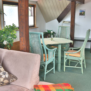 Vorschaubild - Schlafcouch und Sitzecke des Apartments